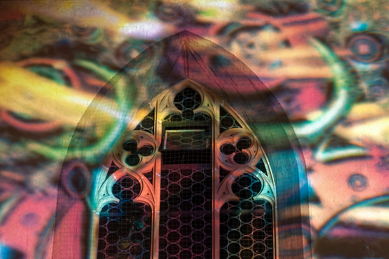 Colourful Mind, coloured projection towards a church wall